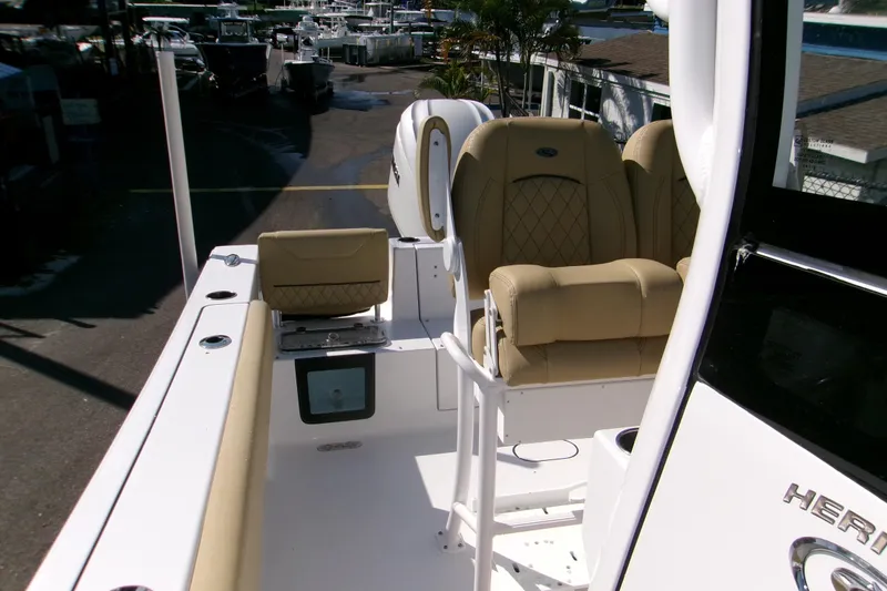 Slide: The Image of 2025 Sportsman Heritage 231 Center Console boat with tan seating and sleek design. - 21