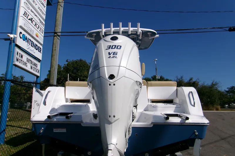 Slide: The Image of 2025 Sportsman Heritage 231 Center Console with powerful 300 V6 engine, displayed outdoors. - 9