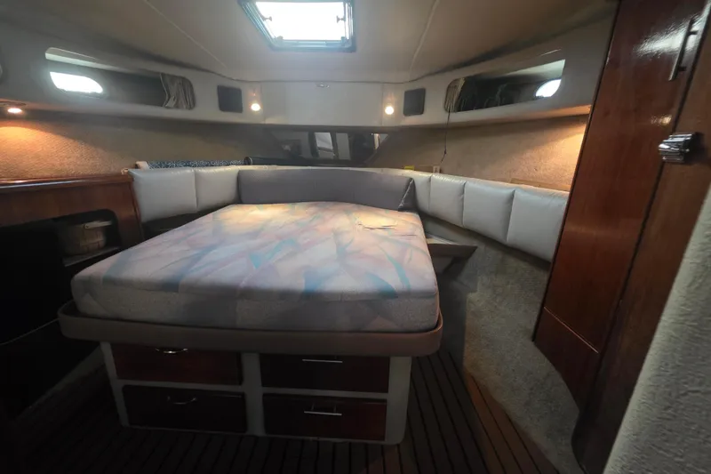 Slide: The Image of Interior cabin of 1989 Bayliner 3888 Motoryacht with bed and wooden accents. - 22