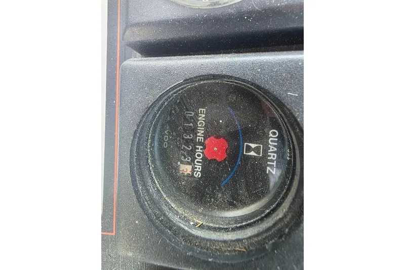 Slide: The Image of Engine hour meter on 1989 Bayliner 3888 Motoryacht dashboard, showing 1323.3 hours. - 39