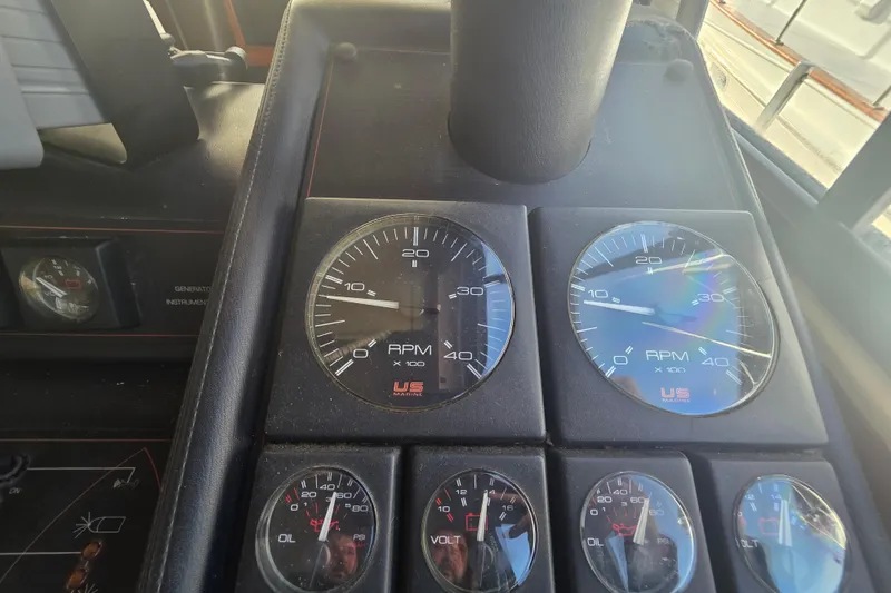 Slide: The Image of Dashboard of 1989 Bayliner 3888 Motoryacht with RPM and volt gauges. - 7