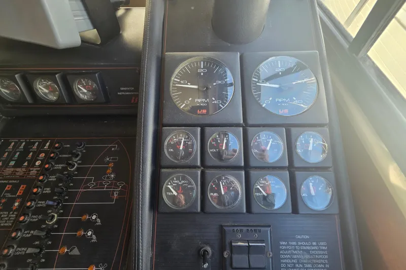 Slide: The Image of Dashboard of a 1989 Bayliner 3888 Motoryacht with gauges and controls. - 8