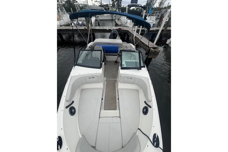 Slide: The Image of 2022 Sea Ray 19 SPX OB boat docked, featuring spacious seating and sleek design. - 10