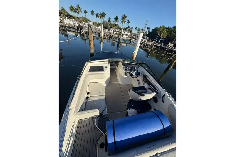 Slide: The Image of 2022 Sea Ray 19 SPX OB boat docked, featuring sleek interior and scenic marina backdrop. - 20