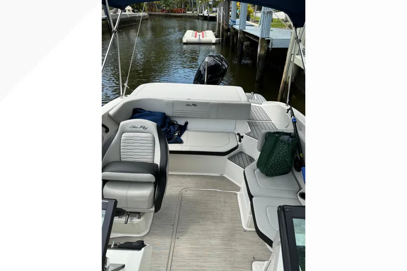 Slide: The Image of 2022 Sea Ray 19 SPX OB boat interior with seating and water view. - 5