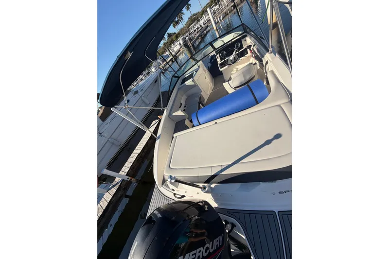 Slide: The Image of 2022 Sea Ray 19 SPX OB boat with canopy, docked at marina. - 7