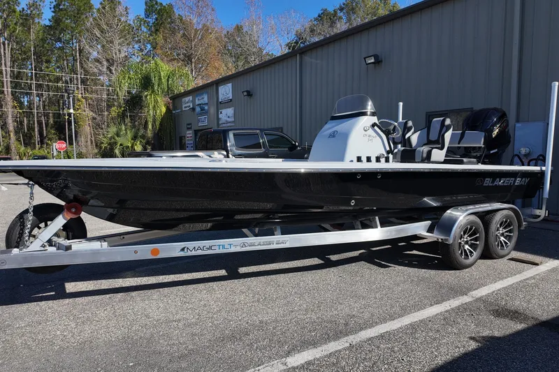 The Image of 2026 Blazer 675 Ultimate Bay boat on trailer, parked outdoors. - 0
