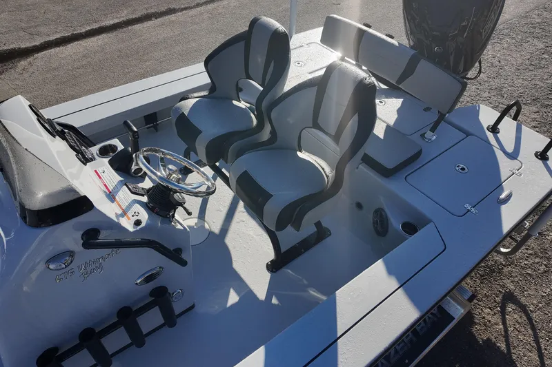 Slide: The Image of 2026 Blazer 675 Ultimate Bay boat interior with dual seats and steering console. - 11