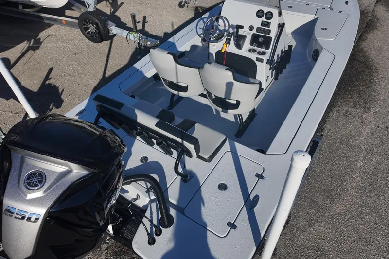 Slide: The Image of 2026 Blazer 675 Ultimate Bay boat with Yamaha 250 engine, interior view. - 6