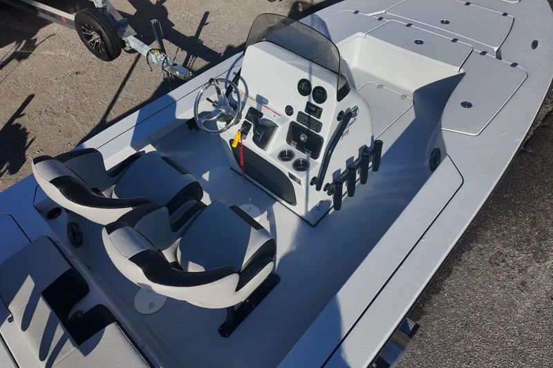 Slide: The Image of 2026 Blazer 675 Ultimate Bay boat interior with dual seats and control panel. - 7