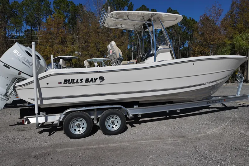 Slide: The Image of 2025 Bulls Bay 255 CC boat on trailer, side view, outdoors. - 3