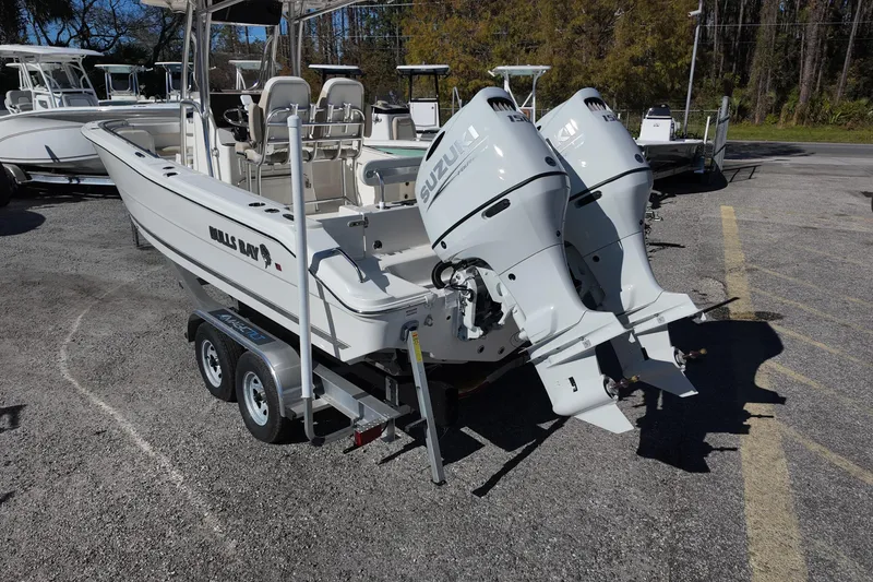 Slide: The Image of 2025 Bulls Bay 255 CC boat with dual Suzuki outboard motors on a trailer. - 5