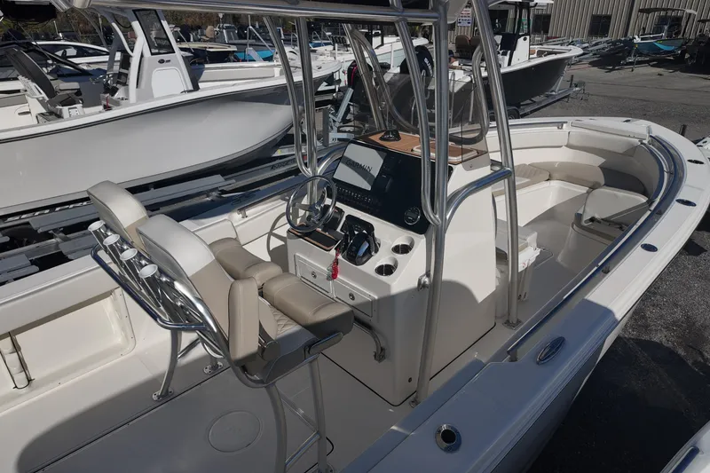 Slide: The Image of 2025 Bulls Bay 255 CC center console boat with modern seating and steering wheel. - 8