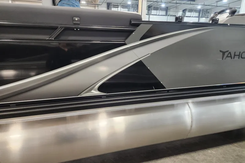 The Image of 2026 Tahoe Pontoon 23 LTZ Quad Lounge boat on trailer, side view. - 0
