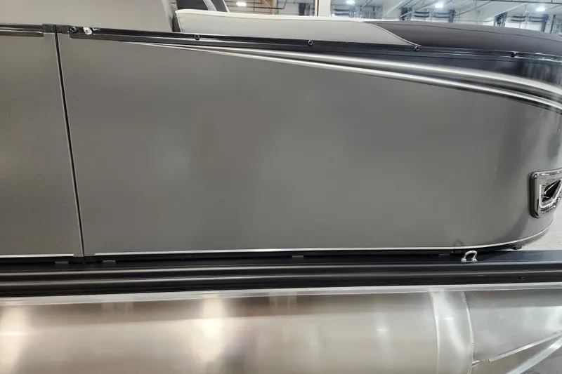 Slide: The Image of 2026 Tahoe Pontoon 23 LTZ Quad Lounge on trailer, showcasing sleek aluminum pontoons. - 12