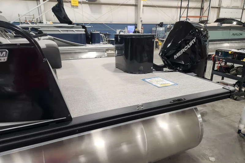 Slide: The Image of 2026 Tahoe Pontoon 23 LTZ Quad Lounge with sleek chrome ladder and spacious deck. - 14