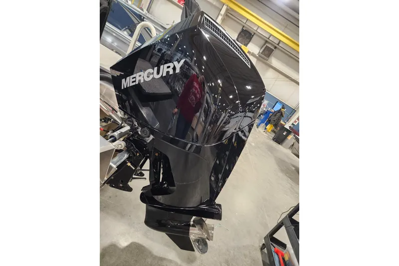 Slide: The Image of Garmin device displaying warning message on Tahoe Pontoon 2026 model dashboard. - 25