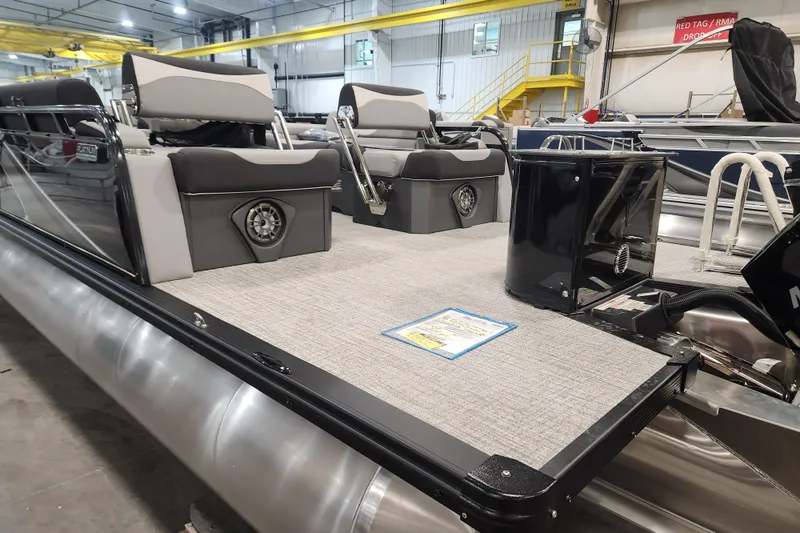 Slide: The Image of 2026 Tahoe Pontoon 23 LTZ Quad Lounge interior with gray cushioned seating. - 29