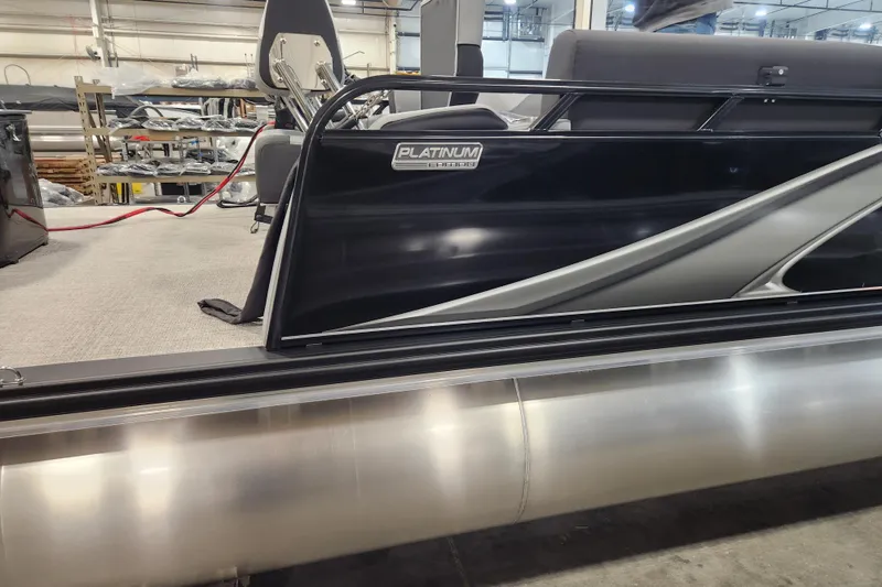 Slide: The Image of 2026 Tahoe Pontoon 23 LTZ Quad Lounge on trailer, sleek design, outdoor setting. - 3