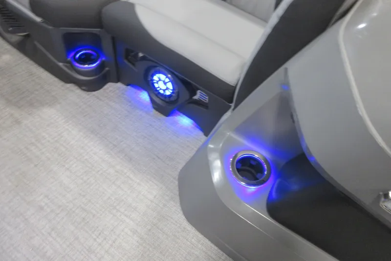 Slide: The Image of 2026 Tahoe Pontoon 23 LTZ Quad Lounge interior with seating and storage compartments. - 41