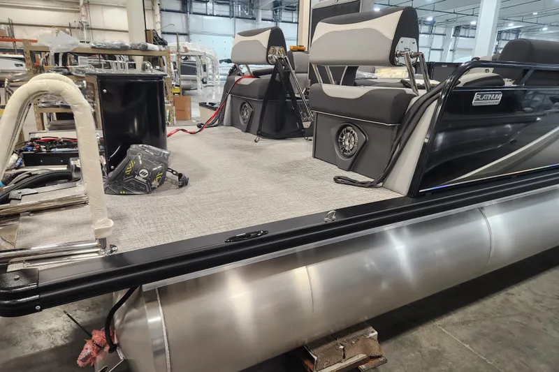 Slide: The Image of 2026 Tahoe Pontoon 23 LTZ Quad Lounge on trailer, featuring Mercury outboard motor. - 5