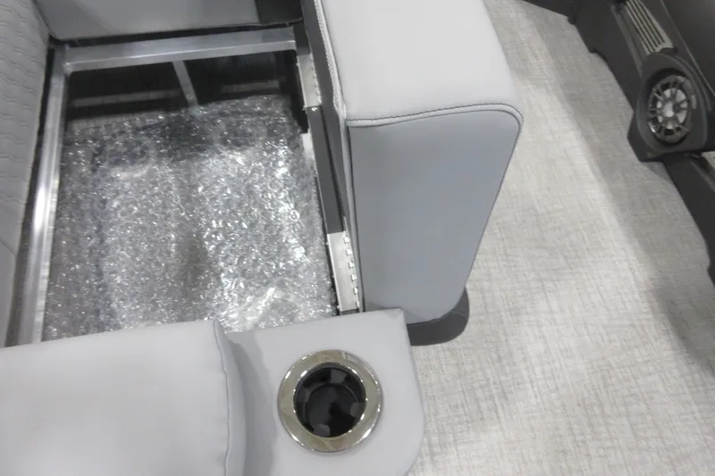 Slide: The Image of 2026 Tahoe Pontoon 23 LTZ Quad Lounge, sleek aluminum hull detail in a workshop. - 62