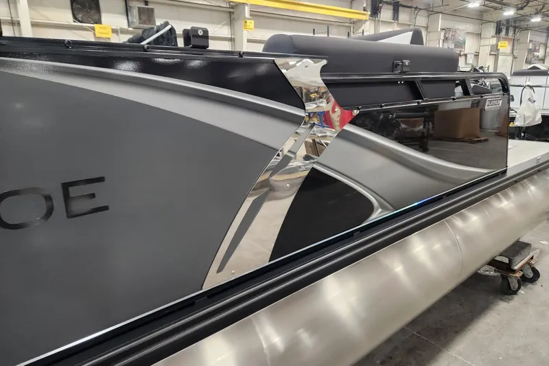 Slide: The Image of 2026 Tahoe Pontoon 23 LTZ Quad Lounge, sleek design in a showroom setting. - 72