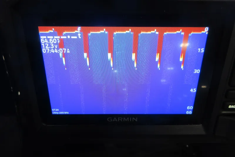 Slide: The Image of Garmin fishfinder display on 2026 Tahoe Pontoon 23 LTZ Quad Lounge, showing depth and temperature. - 81