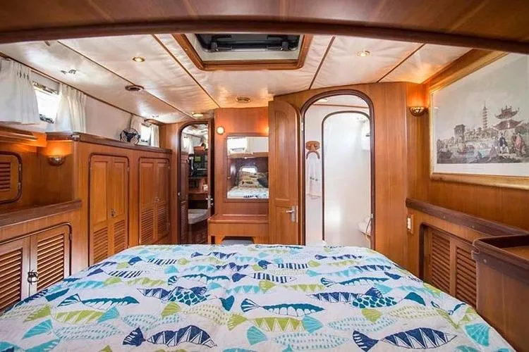 Slide: The Image of Luxurious wooden cabin interior of 1999 Passport 456 yacht with colorful bedding. - 15