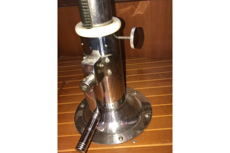 Slide: The Image of Chrome mechanical device on wooden surface, Passport 456 model, 1999. - 24