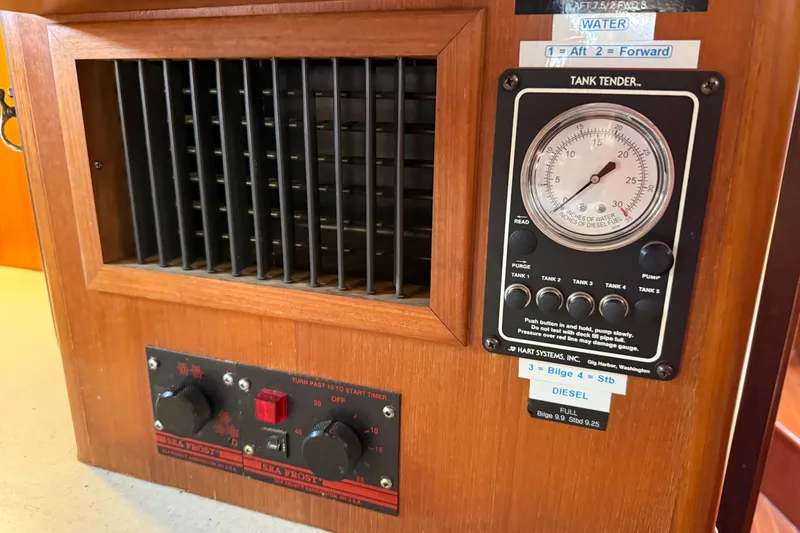 Slide: The Image of Wooden control panel with tank tender gauge and Sea Frost controls, Passport 456, 1999 model. - 31