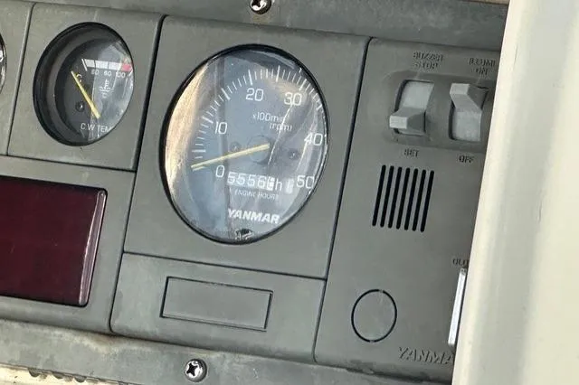 Slide: The Image of Instrument panel of a 1999 Passport 456 with Yanmar engine gauges. - 38
