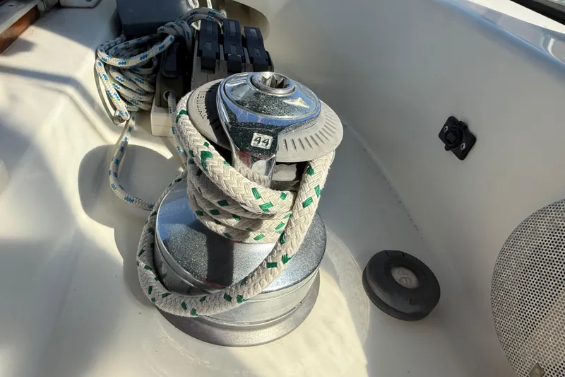 Slide: The Image of Sailboat winch with rope on a 1999 Passport 456 yacht deck. - 39