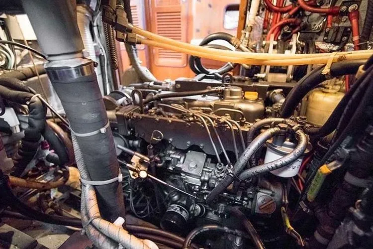 Slide: The Image of Engine compartment of a 1999 Passport 456, showcasing intricate wiring and components. - 40