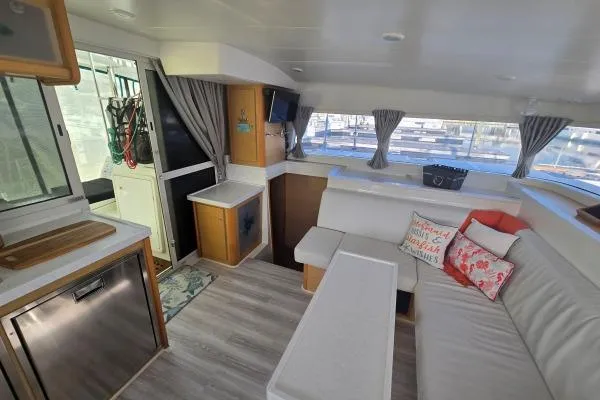 Slide: The Image of Interior of 2011 Lagoon 400 catamaran with modern seating and decor. - 4