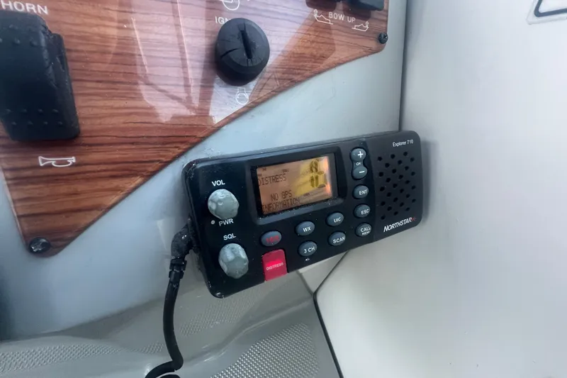 Slide: The Image of VHF radio on 2008 Bayliner 245 Cruiser dashboard, featuring Northstar Explorer 710. - 20
