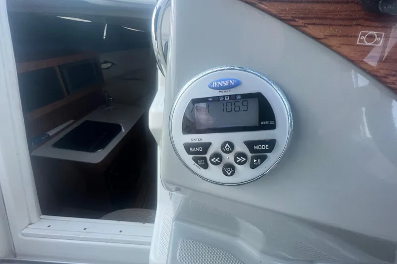 Slide: The Image of 2008 Bayliner 245 Cruiser interior with Jensen radio system. - 21