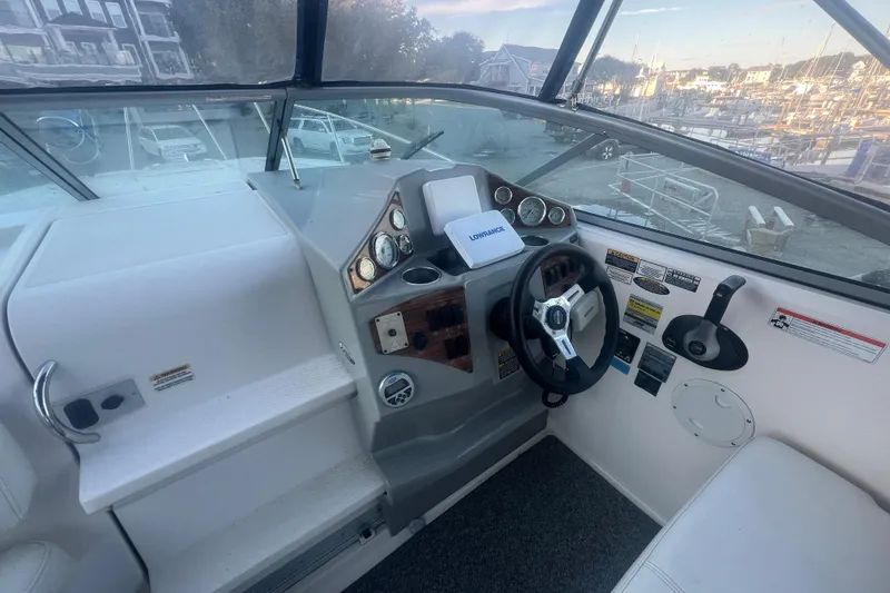Slide: The Image of 2008 Bayliner 245 Cruiser helm with steering wheel and instrument panel. - 5