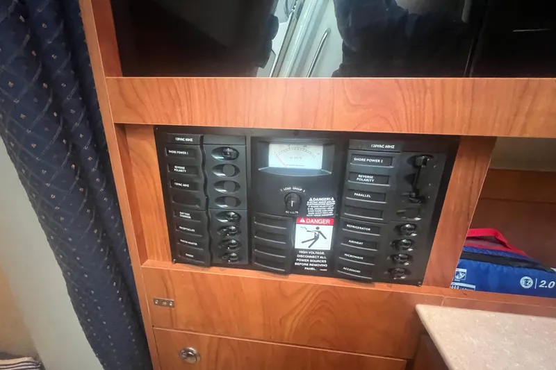 Slide: The Image of Electrical control panel on a 2008 Bayliner 245 Cruiser boat interior. - 6