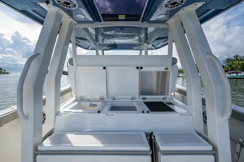 Slide: The Image of 2023 Pursuit S 358 Sport boat interior with modern amenities and ocean view. - 26