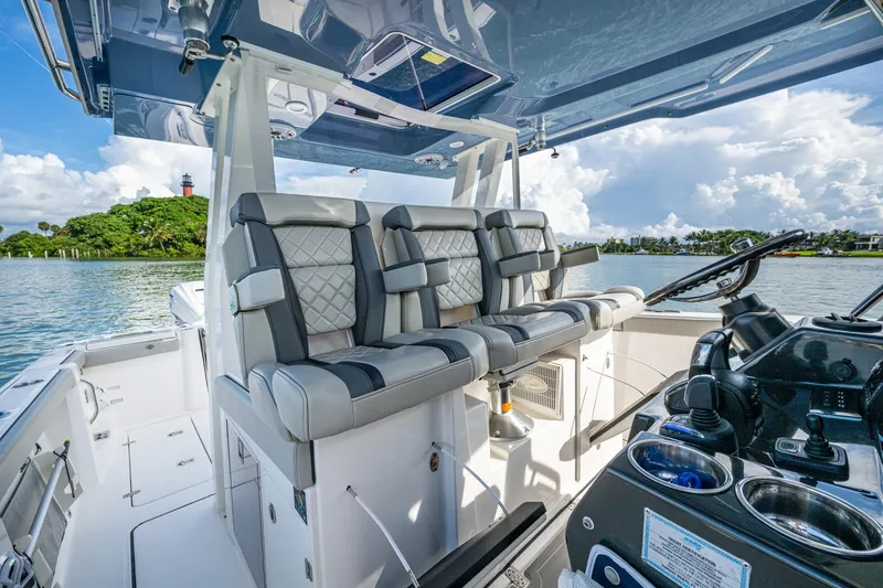 Slide: The Image of 2023 Pursuit S 358 Sport boat interior with luxurious seating and modern helm. - 29