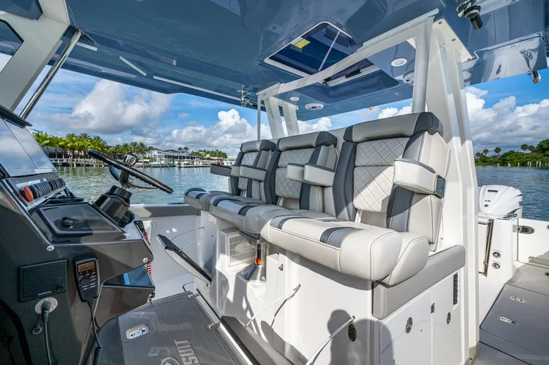 Slide: The Image of 2023 Pursuit S 358 Sport boat interior with luxurious seating and modern dashboard. - 30