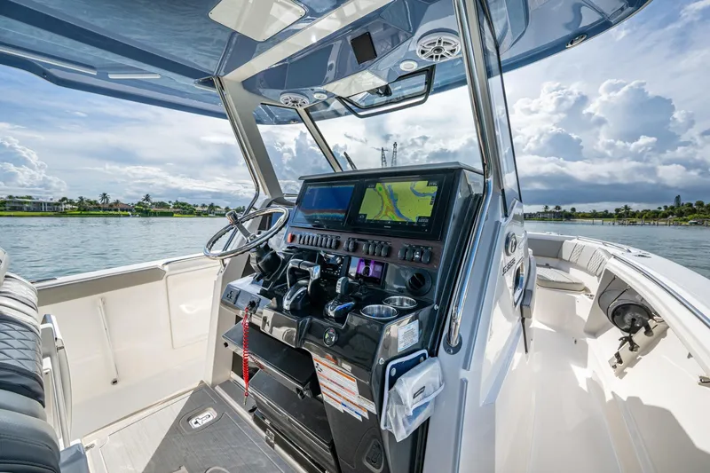 Slide: The Image of 2023 Pursuit S 358 Sport boat cockpit with advanced navigation system. - 33