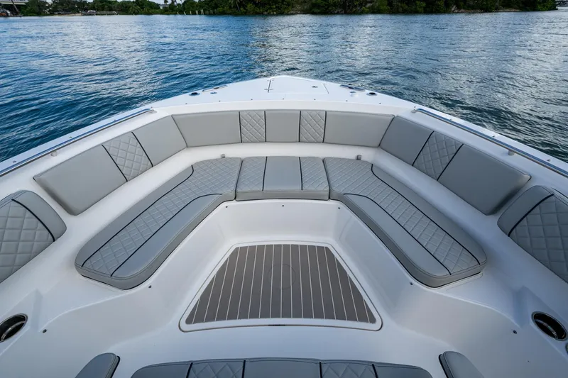 Slide: The Image of 2023 Pursuit S 358 Sport boat with spacious seating on calm water. - 40