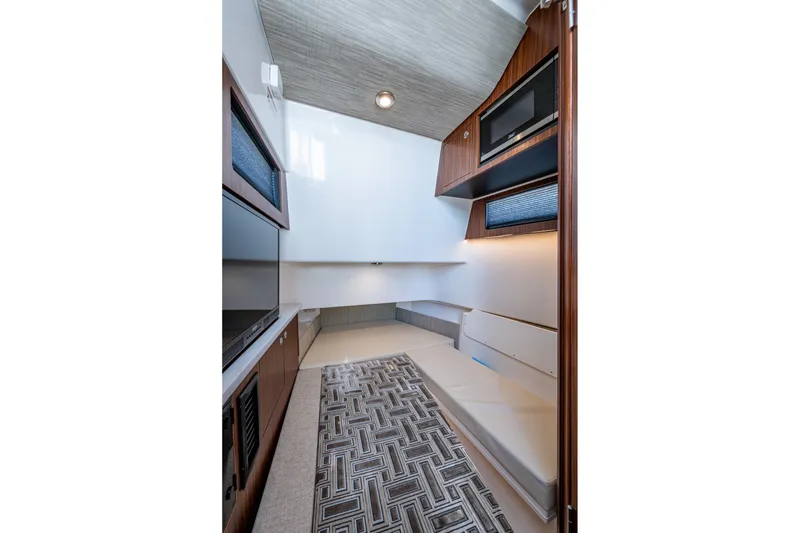 Slide: The Image of 2023 Pursuit S 358 Sport cabin interior with modern design and comfortable seating. - 43