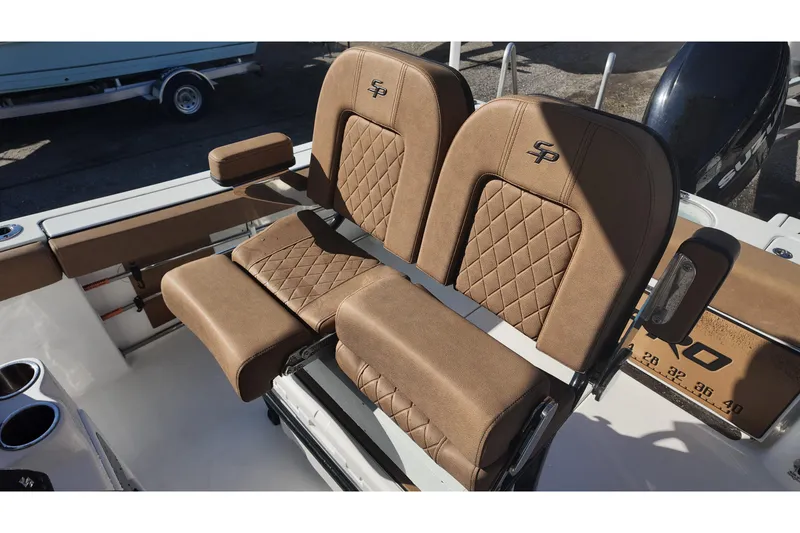 Slide: The Image of 2023 Sea Pro boat seats with brown diamond-stitched upholstery and armrests. - 17