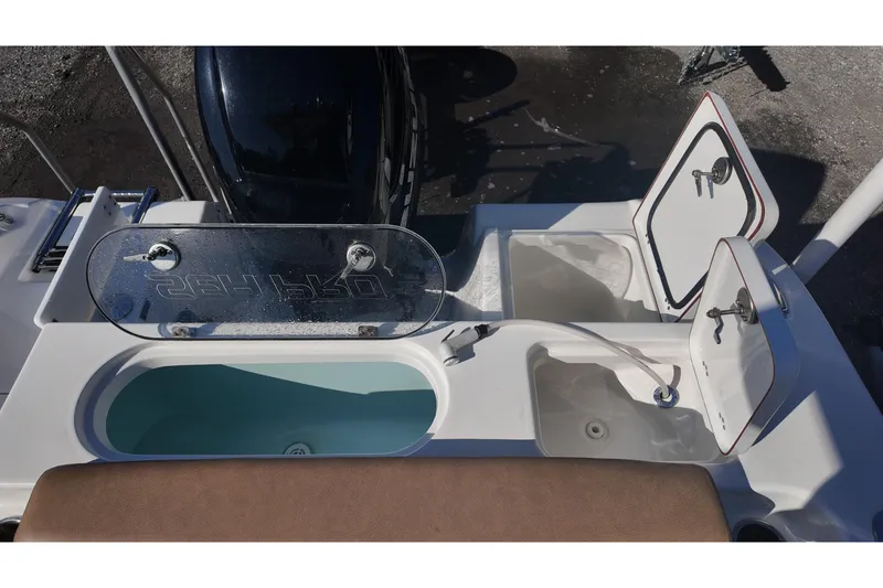 Slide: The Image of 2023 Sea Pro boat with open storage compartments and livewell. - 20