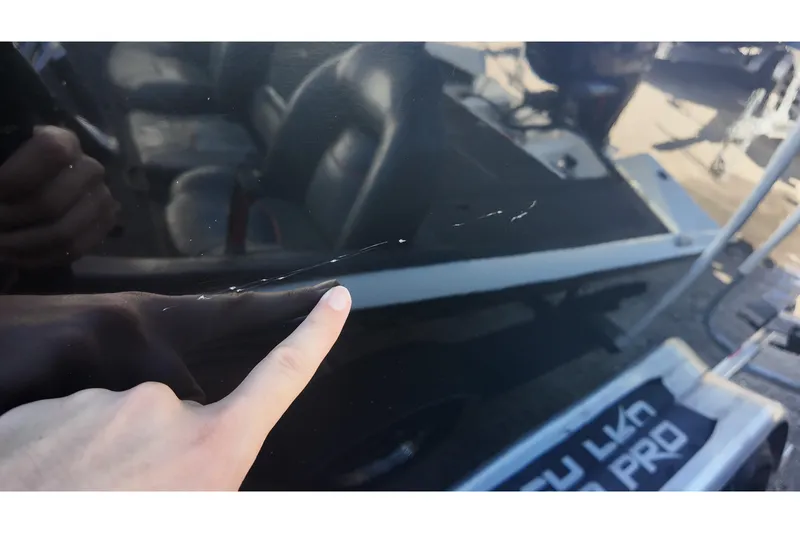 Slide: The Image of 2023 Sea Pro boat with visible scratch on the side. - 26