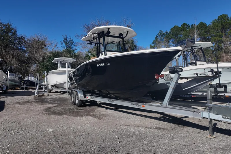 Slide: The Image of 2023 Sea Pro boat on trailer in outdoor storage area. - 3