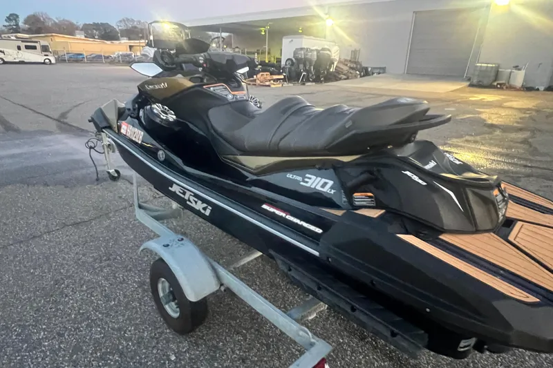 Slide: The Image of 2023 Kawasaki Jetski Ultra 310LX-S on trailer in parking lot. - 13